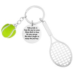 a tennis ball and racket keychain with a quote