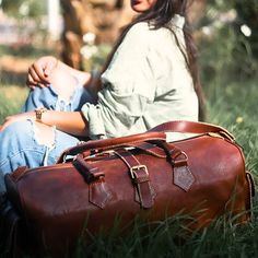 Discover the epitome of luxury and craftsmanship with our Premium Handcrafted Vintage Leather Travel Bag. We believe in only the finest quality, which is why we meticulously select the best Full grain leather for this exquisite creation. Every inch of this bag exudes sophistication and durability, making it the ideal companion for your journeys. Finest Quality Leather: We pride ourselves on sourcing the highest quality leather available. This leather not only adds a touch of elegance but also en Luxury Cognac Satchel Travel Bag, Elegant Vegetable Tanned Leather Travel Bag, Timeless Textured Leather Bag For Business Trips, Elegant Textured Leather Duffle Bag For Daily Use, High-end Leather Travel Bag, Timeless Rectangular Travel Bag With Leather Lining, Elegant Vegetable Tanned Leather Satchel For Travel, Timeless Brown Leather Travel Bag, Luxury Shoulder Satchel With Smooth Grain