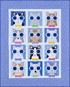 a quilted wall hanging with cats wearing sunglasses