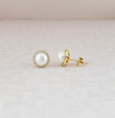 18k Gold Vermeil 925 Sterling Silver Round White Freshwater Pearl Stud Earrings  Pearl Measure Aprox 7mm Lightweight and Hipoallergenic  Comes With A Perfect Gift Box Ideal For Gifting. The Earrings Comes With A 925 Stamped As Symbol Of Guarantee Product Quality You Can Enjoy It For Years And No Worry About Sensitive Skin. 100% Nickel Free / Lead Free                Special Care Keep Your Silver, Gold And Platinum Jewelry Like New With Polishing Cloths.  For More Matching Jewelry Pieces Visit Our Shop  https://www.etsy.com/shop/Orovski  Fast Free Domestic Shipping,  Shipped Within 3 Business Day! Classic Pearl Earrings With Halo Design For Gifts, Classic Gold Pearl Earrings With Prong Setting, Elegant Pearl Earrings With Halo Design As Gift, Classic Gold Earrings With Halo Design, Classic Earrings With Halo Design For Gift, Earrings Gold Pearl, Dangle Pearl Earrings, Pearl Earrings Gold, Platinum Jewelry