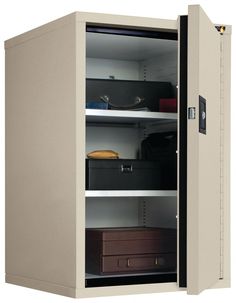 an empty storage cabinet with several suitcases and boxes on the bottom shelf in front of it