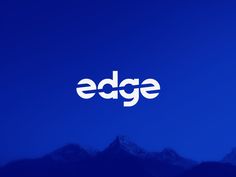 the edge logo against a blue sky with mountains in the background