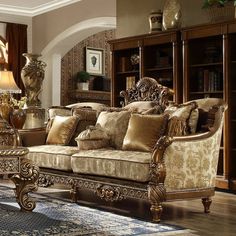 a living room filled with lots of furniture in front of a bookcase full of books