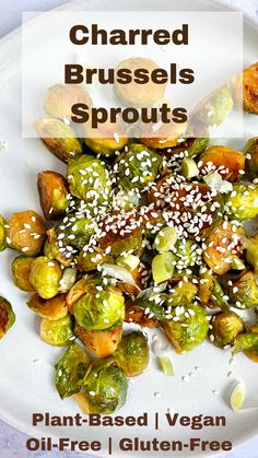 roasted brussel sprouts on a plate with sesame seeds and seasoning