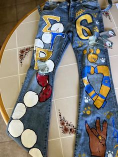 Greek jeans
Customized jeans
Painted jeans 
Sgrho
Pretty Poodle
1922 Sigma Gamma Rho Paraphernalia, Sigma Gamma Rho Outfits, Painted Outfits, Sgrho Paraphernalia, Rho Gamma, Sigma Gamma Rho Sorority, College Graduation Photoshoot, Greek Paraphernalia