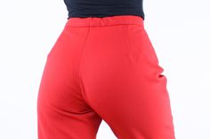 "Item Description This is such a cool pair of vintage high rise stirrup ski pants in a super fun bright red color. These are super comfy and such a great pop of color and pop of vintage style for a day out in the snow. They may not be as water repellent now as they once were, but with a thermal layer underneath they will be warm and you may actually be able to put water proofing spray on them if you are interested in them being a bit more water repellent. They also have the word \"stretch\" in t Retro Fitted Winter Bottoms, Retro Fitted Bottoms For Winter, Fitted Red Bottoms With Belt Loops, Retro Red Bottoms For Winter, Retro Fitted Solid Color Bottoms, Retro Fitted Red Pants, Fitted Red Pants With Belt Loops, Vintage Red Fitted Bottoms, Red Fitted Vintage Bottoms