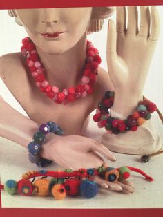 a woman's hands and bracelets are on display