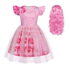 a doll with pink hair and dress on it's head next to a wig