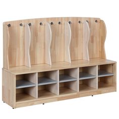 a wooden bench with several compartments and hooks