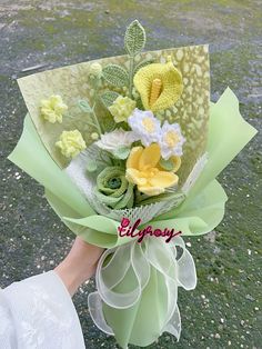 a person holding a bouquet of flowers in their hand with the word enjoy written on it