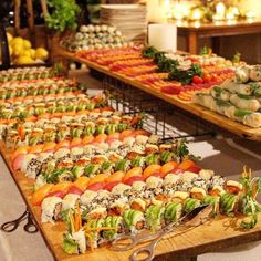 an assortment of sushi on display at a buffet