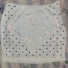 Gorgeous Stretchy White Lined Mini Skirt With Rhinestones, Pearls And Crystals. Very Unique And Eye-Catching! Never Worn. In Great Condition. Measurements: Waist - 14 1/2in Length - 14 1/2in Materials: 90%Nylon 10% Spandex Rhinestone Embellished Mini Skirt For Party, Bedazzled Fitted Bottoms For Party, Rhinestone Mini Skirt For Party, Bedazzled Fitted Party Bottoms, White Mini Skirt For Party Season, Elegant White Sequined Mini Skirt, White Mini Skirt For Night Out And Party Season, Glamorous White Mini Skirt For Party, Glamorous White Mini Skirt