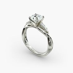 a white gold engagement ring with three stones on the side