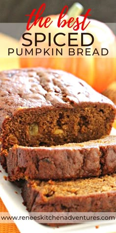 the best spiced pumpkin bread is sliced on a white platter with an orange pumpkin in the background