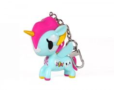 a little pony keychain with a pink hat on it's head