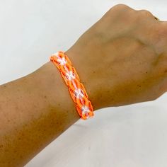 "Handmade friendship bracelet. Woven part measures 6\" and can fit up to 8.5\" wrist with adjustable tie. 100% of proceeds goes to enrolled tribal children." Casual Orange Braided Bracelets For Friendship, Casual Orange Braided Bracelet For Friendship, Handmade Orange Casual Friendship Bracelet, Casual Handmade Orange Friendship Bracelets, Casual Handmade Orange Friendship Bracelet, Adjustable Friendship Bracelets For Festival, Adjustable Friendship Bracelets Gift, Adjustable Band Friendship Bracelets As Gifts, Adjustable Orange Bohemian Friendship Bracelet