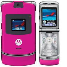 a pink motorola cell phone sitting next to each other