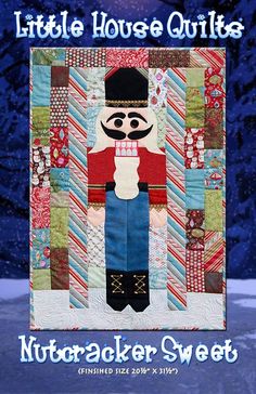 the little house quilts nutcracker sweater pattern is featured in front of snow covered trees