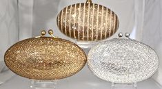 "Heart- stoppingly beautiful design and sparkle! These Evening Formal Oval shaped Purses in gold, gold with pearls and ALL CLEAR will be the talk of town!! Each is handmade. Each takes months to complete, one crystals at a time! Here at Etsy, we offer you the best quality at discounted prices, a fraction of what high priced retailers charge! These are evening bags that are fully covered in genuine, very fine, small sized Swarovski Crystals from Austria! One purse is in all CLEAR CRYSTALS, One is Elegant Sparkling Crystal Evening Bag, Elegant Bling Evening Bag, Luxury Bling Clutch For Formal Events, Luxury Bling Clutch For Formal Occasions, Luxury Formal Clutch With Bling, Luxury Sparkling Clutch For Events, Luxury Sparkling Clutch For Weddings, Luxury Sparkling Evening Bag For Events, Elegant Wedding Clutch With Bling