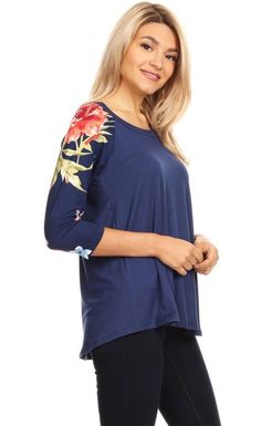 Update your fashion rotation in our trendy floral top for Women. This cute and casual top features 3/4 length floral sleeves and a solid blue center. Created with double brushed fabric, it is extremely soft and comfy. A designer quality shirt every Woman loves to wear. Our blue top for Women is perfect worn alone or layer under a cardigan, duster or jacket. This top also pairs perfectly with any of our buttery soft leggings or jeans. A casual top that is versatile for traveling, running errands Blue Shirt Women, Mom And Me Shirts, Blue Floral Top, Navy Blue Top, Navy Blue Shirts, Buttery Soft Leggings, Mommy And Me Shirt, Soft Leggings, Print Tunic