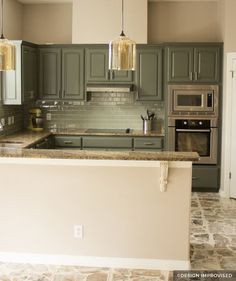 an empty kitchen with granite counter tops and stainless steel appliances