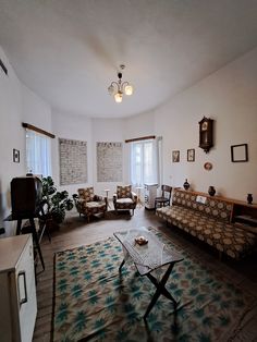 a living room with two couches and a coffee table in the middle of it