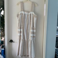 New With Tags White And Tan Stripes Loose-Fitting With Side Pockets Pit To Pit 20” Shoulder Strap To Hem Is 45.5” Cotton/Acrylic Flounced Skirt, Square Neckline Would Be Perfect For A Beach Wedding, Outdoor Picnic, Or Outdoor Bridal Shower. Size Tag Says Petite Large But Regular Large Would Fit Just Fine Too! Cream Sundress For Vacation, Neutral Cotton Beach Dress, Beige Knee-length Sundress For Beach, Beige Knee-length Summer Sundress, Beige Midi Length Dresses For Beach Season, Summer Vacation Midi Dress In Neutral Color, Summer Midi Dress For Vacation In Neutral Color, Cream Knee-length Mini Dress For Vacation, Cream A-line Midi Dress For Beach