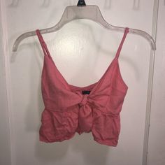 Never Worn Pink Tie Top From Forever 21. Adjustable Straps And Ruffle Along The Bottom. Great Condition, But Seams On One Of The Ties Is Coming Undone (Pictured) And Is Not Very Noticeable. Forever 21 Pink Crop Top For Summer, Forever 21 V-neck Summer Crop Top, Forever 21 V-neck Crop Top For Summer, Forever 21 Pink Crop Top, Forever 21 Pink Crop Top For Spring, Flirty Cotton Crop Top For Summer, Flirty Crop Tank Top For Summer, Forever 21 Casual Summer Crop Top, Trendy Pink Tank Top For Brunch