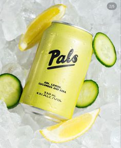 a can of pale lemonade and cucumber soda on ice with lime slices