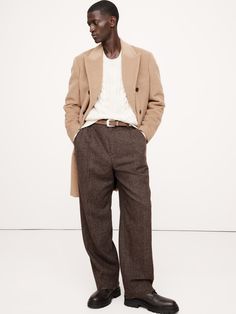 This relaxed pant is cut from a herringbone wool-blend fabric we selected from one of our favorite Italian mills, woven for a warm-handed flannel finish.  Here, we've cut this fabric into a pleated, wide-leg pant with a distinctive puddle hem.  Mid rise.  Wide leg with extra length for a break at the hem Fabric from Italy's Fratelli Balli.  Zip-fly with button closure.  Belt loops.  Front and back pockets.  Lined to the knee.  Wide-leg fit: Mid rise.  Tailored for the at-ease fit of traditional trousers, but with the extra wide-leg and full length of puddle-hem pants.  Wide leg opening measures 10" flat.  Full length.  Inseams: Regular 31. 5" Model: Size 32, 6'2" (188cm). Pants Outfit Men, Hem Pants, Chino Pants Men, Mens Holiday, Holiday Party Outfit, How To Hem Pants, Latest Mens Fashion, Mens Chinos, Shop Mens Clothing