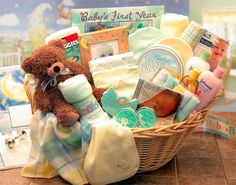 a teddy bear sitting in a basket filled with baby items