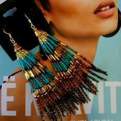 a magazine with a woman wearing earrings on it's face and an advertisement for jewelry