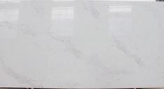 a large white marble slab sitting on top of a hard wood floor