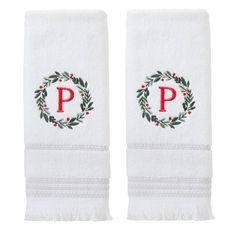 two white towels with the letter p and wreath on each towel, both have red letters