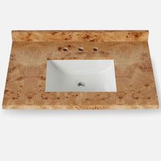 a bathroom sink made out of wood and marble