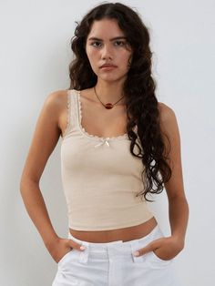 Experience the ultimate in sexy style with this slim-fit tank top made from comfortable jersey fabric. Featuring a solid pattern with lace, tulle, and fishnet elements, this crop top is versatile enough to pair with any bottom. The crew neckline adds a touch of sophistication, making it the perfect addition to your summer wardrobe. Made from high-quality polyester, it's the ultimate must-have for the season. Tops For Party, Lace Camisole Top, Solid Tank Tops, Club Night, Lace Camisole, Sleeveless Crop Top, Solid Clothes, Top Fabric, Tank Top Cami