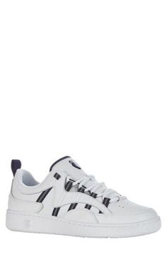 This modern sneaker celebrates the brand's authetic tennis heritage and takes inspiration from early '90s designs. The signature five stripes have eye-catching reflective touches and a clean court sole. Lace-up style Cushioned footbed Leather upper/textile lining/rubber sole Imported Lace-up Sneakers With Three Stripes For Streetwear, Low-top Three Stripes Skate Shoes, Low-top Skate Shoes With Three Stripes For Skateboarding, Classic Skate Shoes With Three Stripes For Streetwear, Streetwear Synthetic Sneakers With Three Stripes, Urban Low-top Sneakers With Three Stripes, Classic Sneakers With Three Stripes For Streetwear, Classic Three Stripes Sneakers For Streetwear, White Athleisure Skate Shoes With Vulcanized Sole