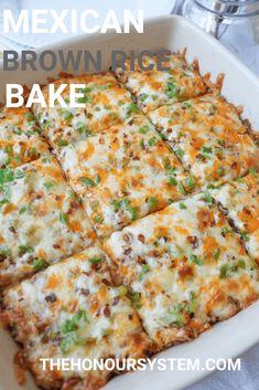 a casserole dish with cheese, green onions and other toppings in it