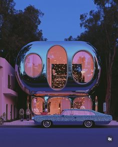 a car is parked in front of a futuristic house