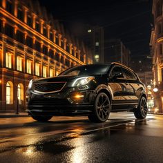 a black suv driving down a city street at night