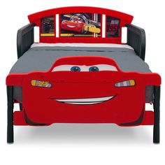 the bed has cars on it and is red