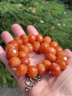 "This striking carnelian choker features 27 large faceted golden brown colored beads. Each bead is .625\" wide x .325\" thick. Between the beads are tiny silver spacer beads from Bali. It is finished with a handmade silver toggle clasp. Length 16\" Width .625\" Additional Information: * Complimentary Gift Box! * All jewelry items come securely packaged and are mailed promptly upon payment - often same-day. * The majority of my vintage items are used and may show some wear. Please review all phot Luxury Carnelian Jewelry Gift, Orange Round Faceted Beads Jewelry, Faceted Amber Round Bead Jewelry, Faceted Orange Beaded Necklace As Gift, Vintage Orange Jewelry With Faceted Beads, Orange Vintage Jewelry With Faceted Beads, Vintage Faceted Beads Gems And Cabochons As A Gift, Vintage Faceted Beads For Gifts, Gift Carnelian Faceted Beads