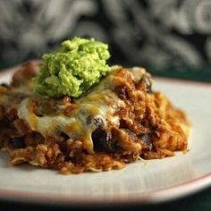 a close up of a plate of food with broccoli and cheese on it