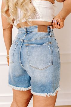 - Update your denim collection with this trendy option! - Unlined denim material with distressed detailing - A rigid non-stretch front and a stretchy back - A high waistline with belt loops and five button closure - A functional four pocket cut - A flattering silhouette that ends in frayed hemlines Measurements 1XL : Front Rise 14.5", Hip 44", Inseam 5.5", Length 17", Waist 34". 2XL : Front Rise 15.5", Hip 46", Inseam 5.5", Length 18", Waist 36". 3XL : Front Rise 16", Hip 48", Inseam 6", Length Denim Collection, Denim Material, Distressed Shorts, High Waist, High Waisted, Blue