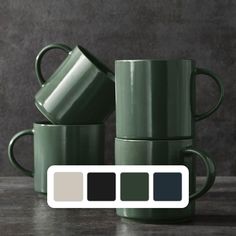 three green coffee mugs sitting next to each other