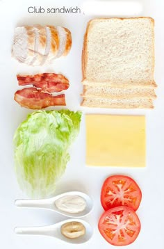 an assortment of food is displayed on a white surface