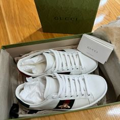 Elevate Your Sneaker Game With These Stylish Gucci Ace Sneakers. The White Leather Sneakers Feature Embroidered Bees, Adding A Touch Of Luxury To Your Casual Look. The Low Top Design And Athletic Style Make Them Perfect For Everyday Wear. These Sneakers Are A Size Us 5 (35) And Are Perfect For Any Fashionable Women's Wardrobe. I’ve Only Worn These Once. They’re Basically Like New. Clean And Available With Original Box, Wrapping, And Dust Bags. Proof Of Purchase And Authentication Card Available. Gucci Shoes Women, Gucci Ace Sneakers, Box Wrapping, White Leather Sneakers, Athletic Style, Sneaker Games, Athletic Fashion, Top Design, Gucci Shoes