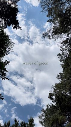 the words waves of green are written in front of some trees and blue sky with white clouds