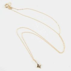 The INEZ Tiny Star Pendant Necklace is unique and stylish - perfect for every mood and every occasion. Convey your classy personality with this necklace. This sleek piece features a tiny 4-point star with a diamond in the center in 14K gold on a delicate 14K gold chain. With a simple design and clean finishes, this necklace will polish off your elegant looks effortlessly. Features: Very comfortable Lightweight feel Tiny 4 point star Elegant and minimal High quality Hypoallergenic Size & Material