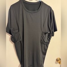 Ordered The Wrong Size , Brand New Never Worn. 2 Pockets For Conceal Carry Black Crew Neck Tops With Pockets, Black Sporty T-shirt With Pockets, Sports Tops With Pockets And Crew Neck, Black Crew Neck Top With Side Pockets, Black Sporty Tops With Pockets, Sporty Black Tops With Pockets, Black Sports Top With Pockets, Sporty Black T-shirt With Pockets, Casual Black Tops With Side Pockets